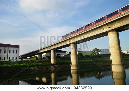 Singapore Mass Rapid Train (mrt) Travels On The Track