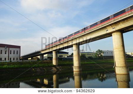 Singapore Mass Rapid Train (mrt) Travels On The Track