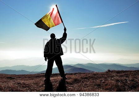 Silhouette of a man waving Argentinian flag