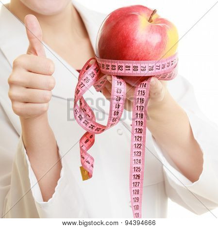 Doctor Specialist Holding Fruit Apple And Measure Tape