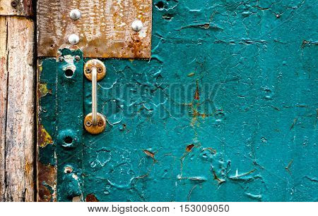 The old vintage wooden doors with doorknob, seagreen colour