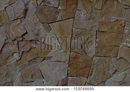 Background art on wall built of stone.