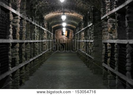 Wine bottles in winery cellar