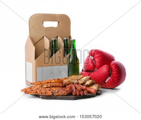 Beer with snacks and boxing gloves on white background