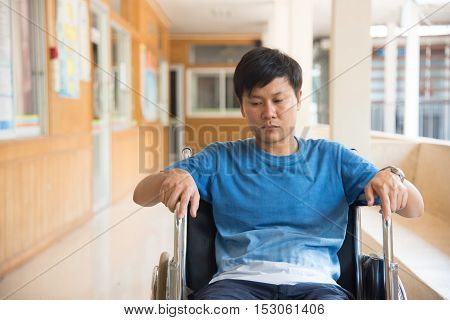 patient in wheelchair parked in hospital with selective focus.