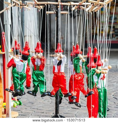 Traditional Italian toys. Wooden pinocchio puppet as a souvenir of Italy