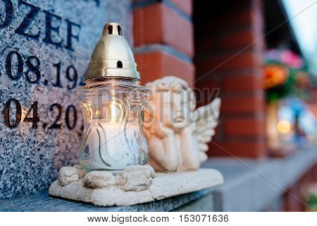 Candles Burning At A Cemetery