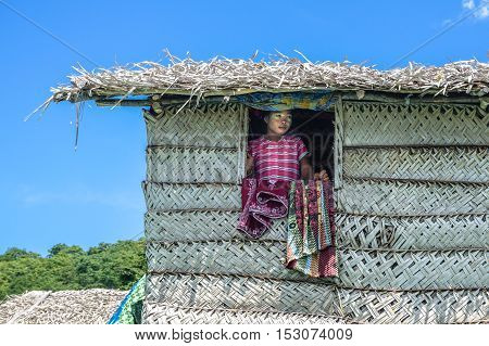 Semporna,Sabah-Sept 10,2016:Sea Gypsy kids on the house on 10th Sept 2016 at Bodgaya Island,Semporna,Sabah.The kids are taught to catch fish,octopus & lobsters off their unique handmade boats