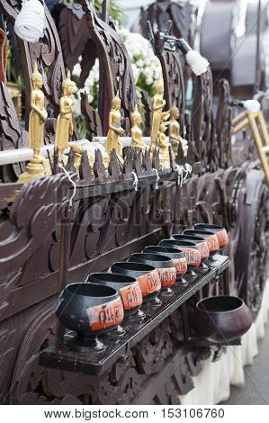 Suratthani, Thailand - October 20, 2016: Details on ornamented carriers of Buddha images to be pulled across the city during the famous Chak Phra Festival, an annual Buddhist festival to celebrate the return of Buddha from heaven to earth after the end of