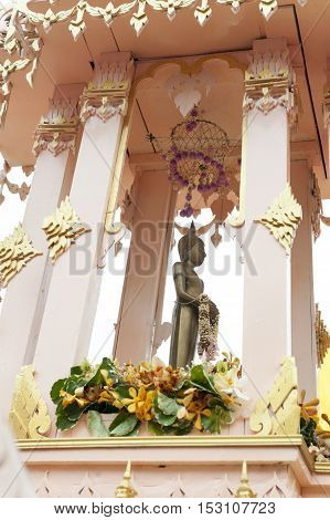 Suratthani, Thailand - October 20, 2016: Details on ornamented carriers of Buddha images to be pulled across the city during the famous Chak Phra Festival, an annual Buddhist festival to celebrate the return of Buddha from heaven to earth after the end of