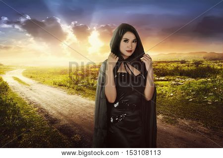 Beautiful Asian Witch Woman With Black Hood