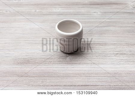 White Cup For Sake On Gray Brown Wooden Table