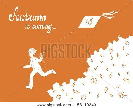 Boy running and flying a kite on the orange background with leaves
