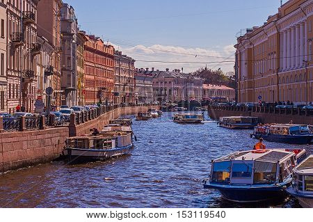 The river in town, historic buildings, waterfront, boats