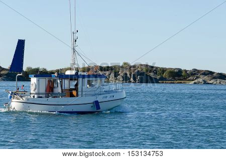 one small fishingboat on the swedish westcoast going out and fish