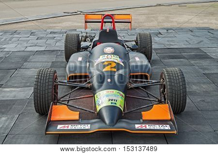 Dnepropetrovsk Ukraine - October 06 2013: Exhibition of cars and motorcycle and other vintage technics. The automobile which will participate in the for demonstration races