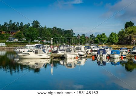 Falkensten town marina. Recreational fleet of motor boats. Norway.