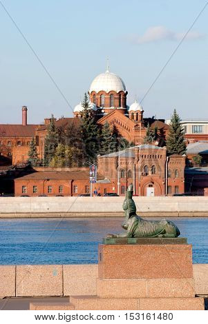 Saint - Petersburg, Russia - October 24, 2016: Monument to victims of political repressions (Chemiakin Sphinxes).On the background is Kresty (Crosses) Prison with Orthodox Church of St. Alexander Nevsky