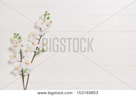 Feminine, elegant woman's white, wooden table, desk or workspace seen from above. Top view background with copy space. Creative workspace for freelance girl working from home