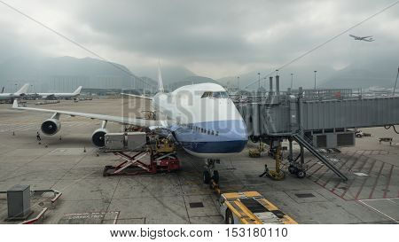 Loading cargo containers into the airplane with airbridge 
