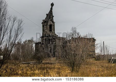 An old abandoned decayed wooden Church of the Intercession of the Holy Virgin in the village Aldia, Tambov region, Russia