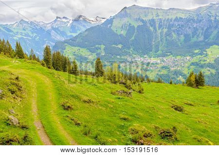 Beautiful Swiss mountain valley landscape with trail.