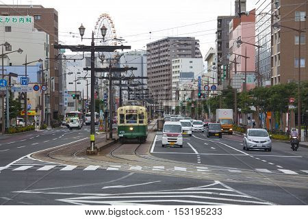 Nagasaki, Japan - August 19, 2015 Cars And Vintage Tram On The Road
