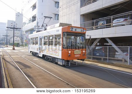 Nagasaki, Japan - February 28, 2016 Cars And Vintage Tram On The Road