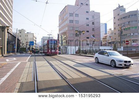 Nagasaki, Japan - February 28, 2016 Cars And Vintage Tram On The Road