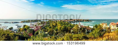 SOZOPOL - AUGUST 9: boats at sunset on August 9 2015 in Sozopol Bulgaria. boats and yachts docked near embankment in port of Bulgarian town Sozopol in evening light