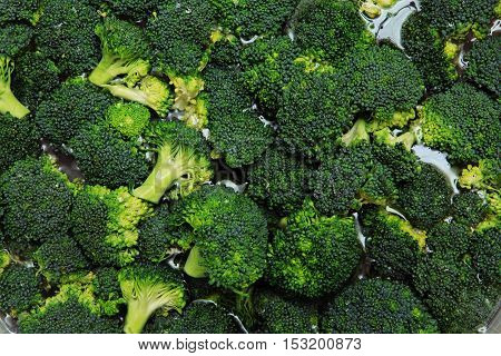 Macro closeup of green vegetables: cut broccoli. Broccoli texture closeup for any ideas. Fresh vegetables concept.