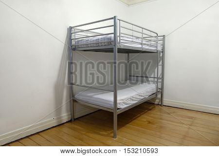 Simple bunk bed in the corner of a room