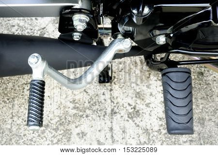Black kick start motorcycle and motorcycle footrest