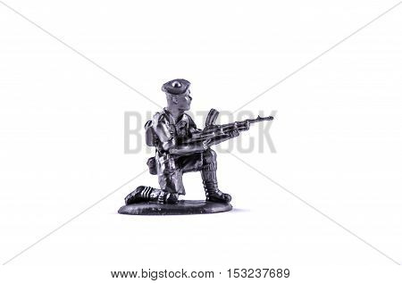 miniature toy plastic soldier  on white background