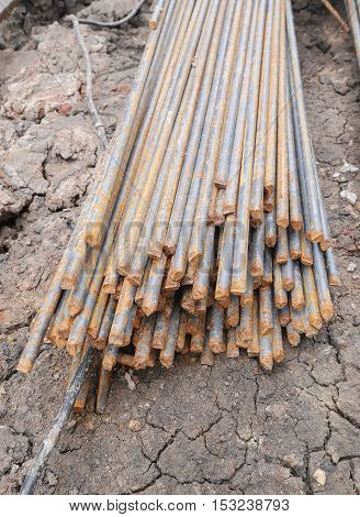 Steel rods or bars used to reinforce concrete in construction