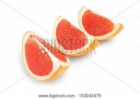 fresh grapefruit wedge isolated on a white background.