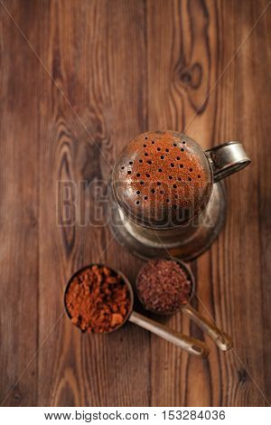 vintage sifter with grated chocolate and  100% chocolate block