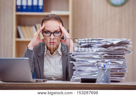 Busy stressful woman secretary under stress in the office