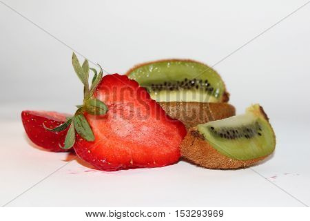 composition with cutting strawberries and kiwi on a white background