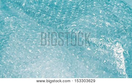 Close up colored bubble wrap. Protective foil texture nobody.