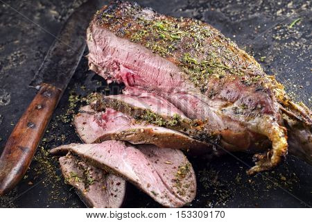 Barbecue Haunch of Venison on old Metal Sheet