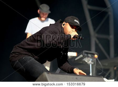 NEWPORT, ISLE OF WIGHT, UK - SEPTEMBER 9 2016: British rapper Kano , aka Kane Brett Robinson performing on stage at Bestival festival on the Isle of Wight
