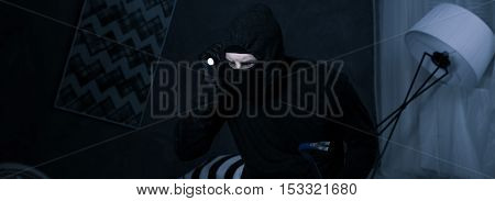 Robber Looking For The Valuable Estate