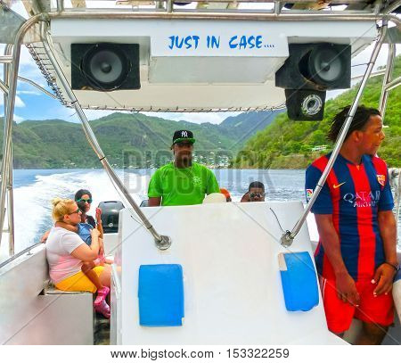 Saint Lucia Saint Lucia - May 12 2016: The people enjoying of boat trip to the mountains Pitons near a beautiful caribbean beach at Saint Lucia island at Caribbean