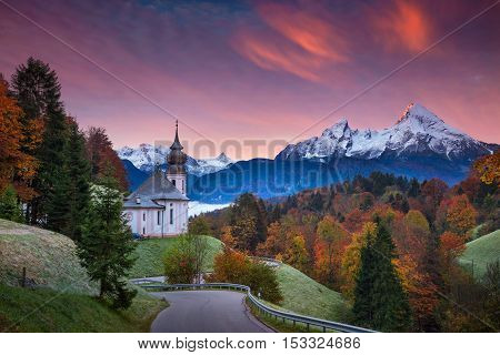 Autumn in Alps. Image of  the european Alps with Maria Gern Church during beautiful autumn sunrise.