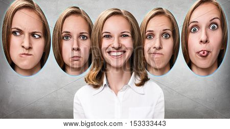 Young girl changes her face portraits with different emotions over gray background
