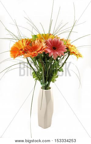 Assorted gerbera flower bouquet, arrangement, in asymmetrical white minimalist vase, isolated on white background, good for cards brochures, menus, wallpaper