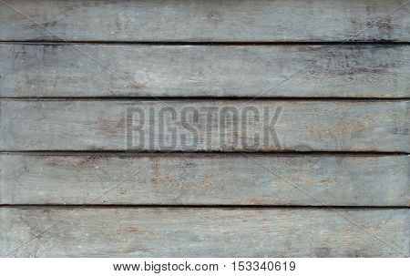 Horizontal grey rustic wooden table texture taken from the top.