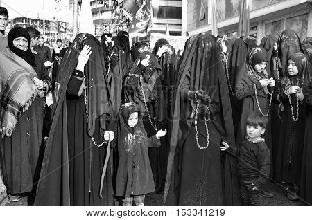 Istanbul Turkey - October 11 2016: Turkish Shia women takes part in an Ashura parade in Istanbul's district of Kucukcekmece. Turkish Shia Muslims mourning for Imam Hussain. Caferis take part in a mourning procession marking the day of Ashura in Istanbul's