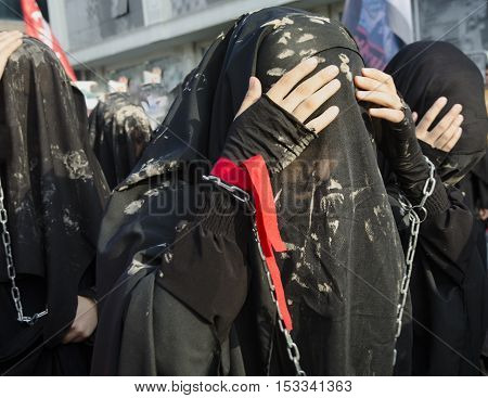 Istanbul Turkey - October 11 2016: Turkish Shia girls takes part in an Ashura parade in Istanbul's district of Kucukcekmece. Turkish Shia Muslims mourning for Imam Hussain. Caferis take part in a mourning procession marking the day of Ashura in Istanbul's